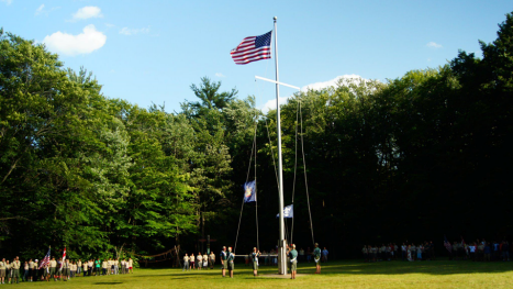 Scouts at colors in parade field